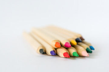 Colorful wooden pencils isolated on white background