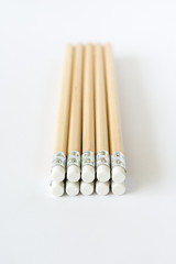 Wooden pencils erasers on white background isolated