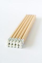 Wooden pencils erasers on white background isolated