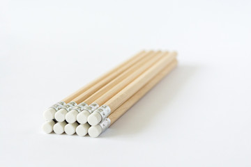 Wooden pencils erasers on white background isolated