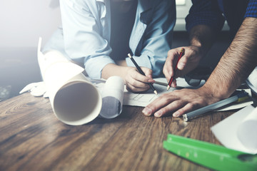 Team of architects working on construction plans