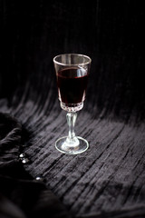 nice glass of red wine on a black background Velvet.