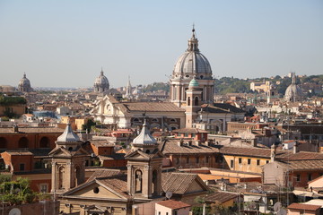 Fototapeta na wymiar View to many churches in Rome, Italy