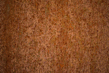 Texture of rust on metal wall in orange brown color that is rusty ans seamless