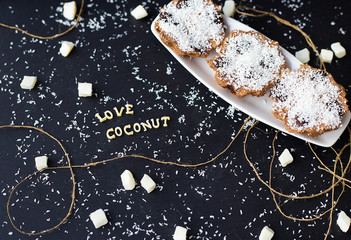 coconut muffins on a black background with words like candied fruits and coconuts