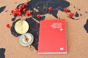 Swiss passport and compas on the pinboard ma © pincasso