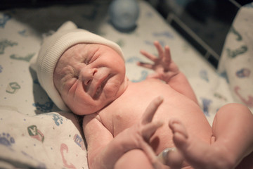 Cute newborn making scrunchy face