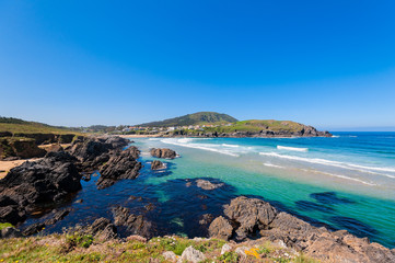 Landscape with sea,cliff, beach and blue sky.