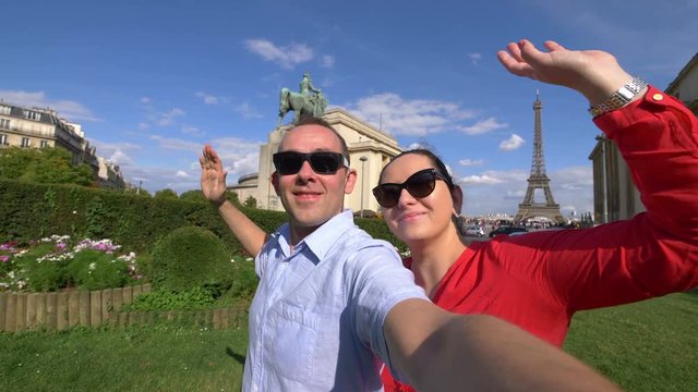 Professional video of couple taking selfie with a view of Eiffel Tower in Paris in 4k slow motion 60fps