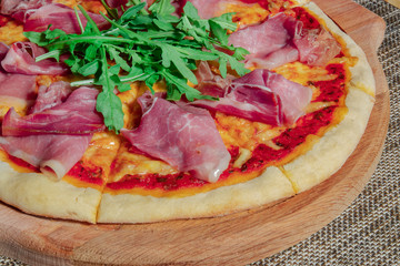 homemade lush pizza with parma and arugula