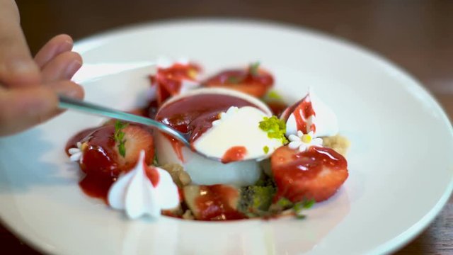 fruit pudding with fresh strawberry and cracker with red berry sauce