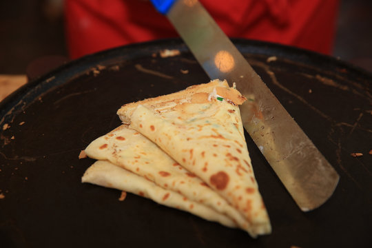 Cooking French Crepe on Street Market in Germany
