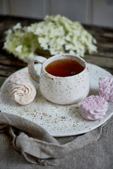 Delicate pastel colors. Tea party in the open air. Ceramics in a rustic style, handmade. Delicate marshmallow pink shades.