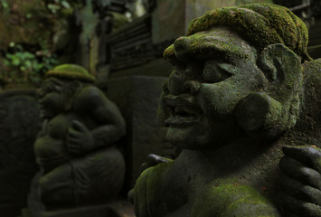 Balinese ancient stone sculpture. Bali, Indonesia.