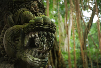 Fototapeta na wymiar Balinese ancient stone sculpture. Bali, Indonesia.