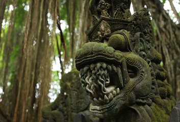 Balinese ancient stone sculpture. Bali, Indonesia.