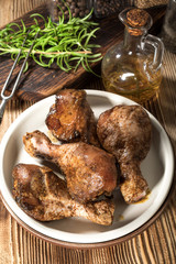 Raw marinated chicken drumsticks.