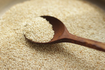 sesame seeds in a wooden spoon