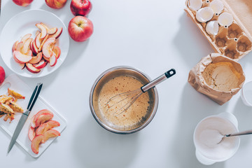 Ingredients and tools for cooking apple pie
