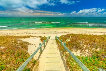 Poster Wooden stairs for Mettams Pool, North Beach near Perth, Western Australia. Mettam's is a natural rock pool protected by a surrounding reef. Summer season. © bennymarty