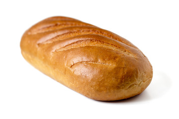A loaf of white bread from wheat isolated on a white background