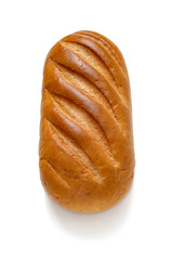 A loaf of wheat bread isolated on a white background. Top view