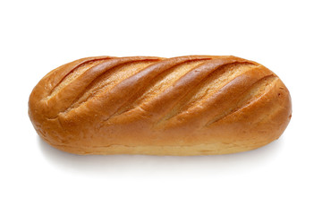 A loaf of fresh white wheat bread isolated on a white background. Top view