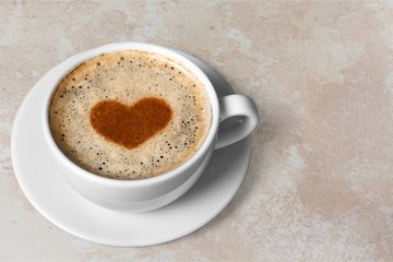 Coffee cup on wooden background