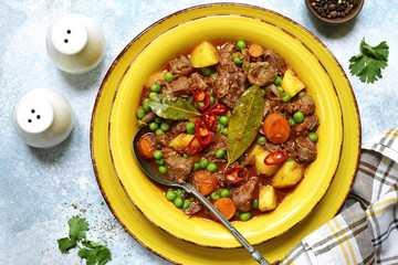 Slow cooker beef ragout with vegetable ( potato, sweet pea and carrot ) . Top view.