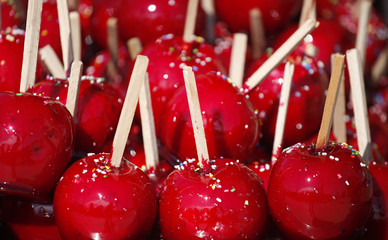 Delicious candy apples covered with colorful sprinkles