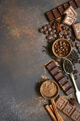 Ingredients for making chocolate cake or candy : chocolate chips, bar and spices.Top view with copy...