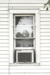 Old Decaying Exterior Window With Air Conditioner