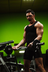 Fototapeta na wymiar The man in the gym.Guy's training.The Sports Guy.Man's health