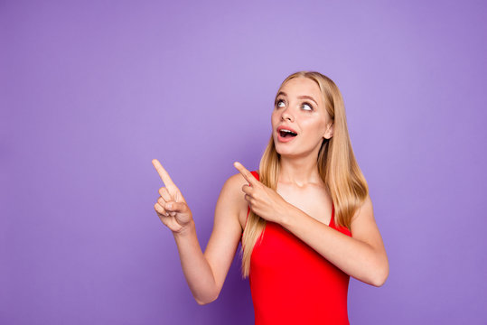 What is it? I want it! Close up photo portrait of astonished cute pretty beautiful funny funky comic joking lady showing to the side isolated bright pastel background