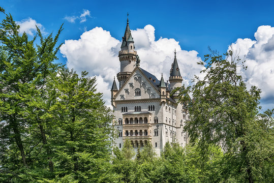 Hohenschwangau, Germany - June 10, 2018: The idyllic Neuschwanstein Castle positioned high up on a mountain in the Bavarian Alps. Commissioned by King Ludwig II of Bavaria.