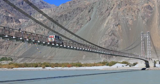 Long bridge in Himalaya mountains over Nubra river in Ladakh, north India