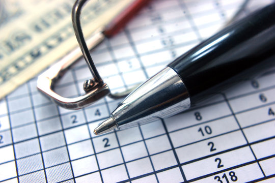 table number pen glasses money close-up, concept of work analyze calculations figures bisces,