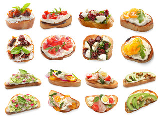 Set with different delicious bruschettas on white background