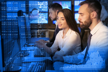 Stock traders working in office