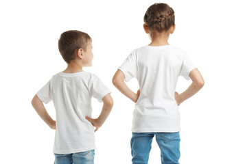 Fototapeta premium Little kids in t-shirts on white background. Mockup for design