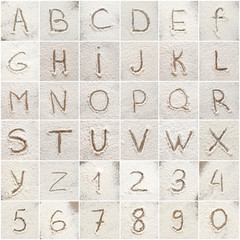 Set with letters and numbers written on scattered flour