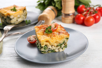 Lasagna with spinach on table