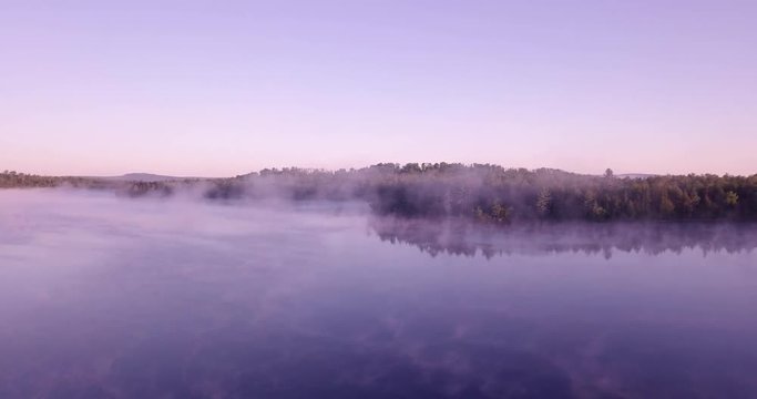 Chilly summer sunrise in northern Maine with some killer mist and colors around a small lake.