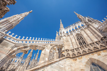 view of Gothic architecture and art on the roof of Milan Cathedral (Duomo di Milano), Italy