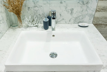 Interior of bathroom with sink basin faucet and mirror. Modern design of bathroom