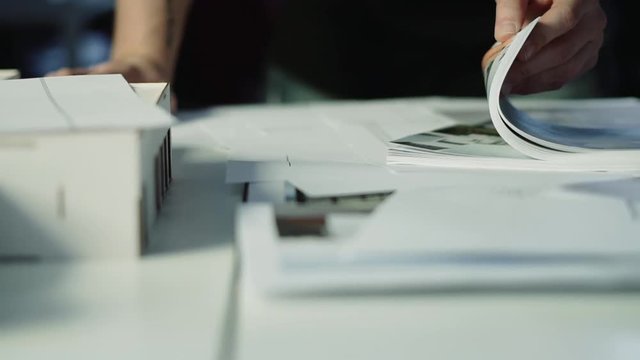 Turning pages of the brochure