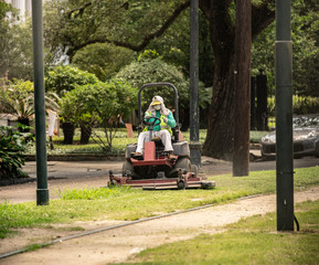 unknown landscaper wears breathing protection for airborne dust particles