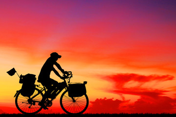 silhouette Sport man whit bike on sunrise