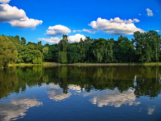 Cloudy summer day reflection on lake