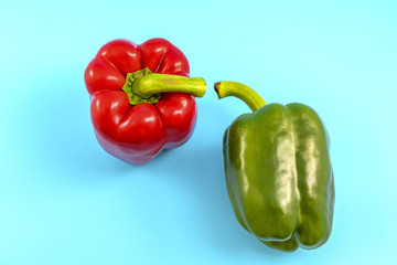 Red Sweet bell pepper and Green Sweet bell pepper isolated on Blue background.